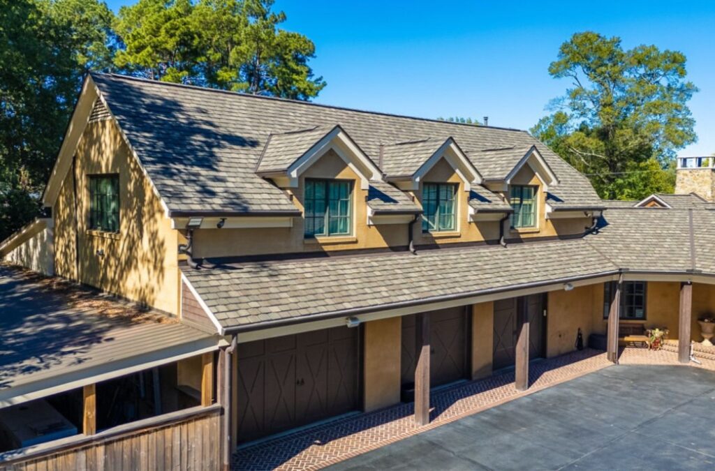 A Surge Exteriors professional installing a high-quality roof in Quincy, IL, ensuring durability and expert craftsmanship.