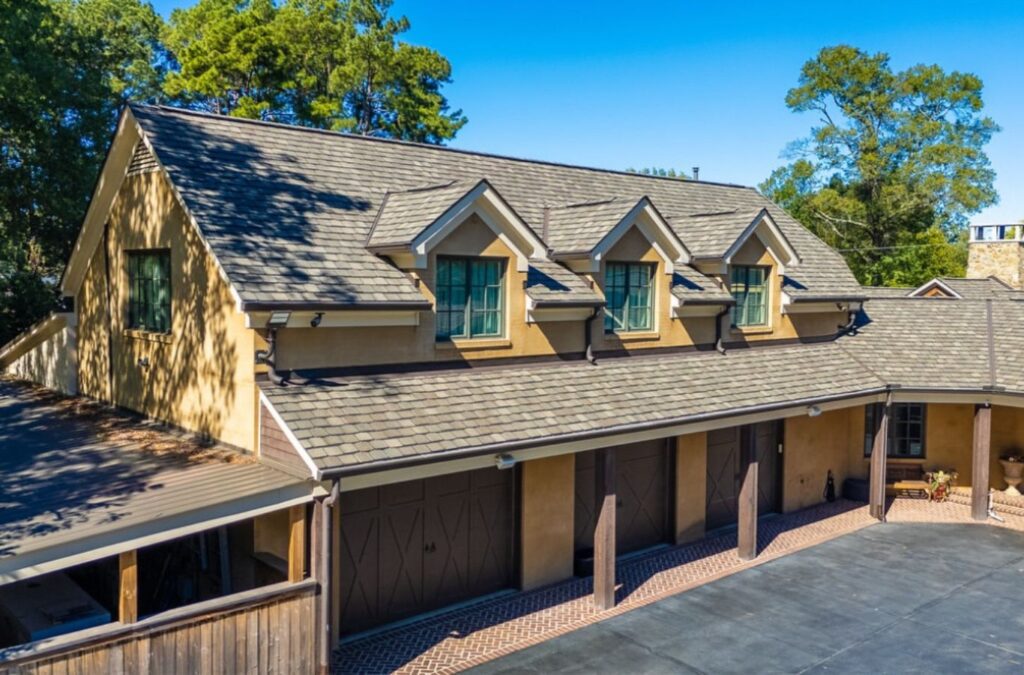 A Surge Exteriors employee providing expert roof repair services in Canton, MO, showcasing professional tools and skills for premium-quality work.