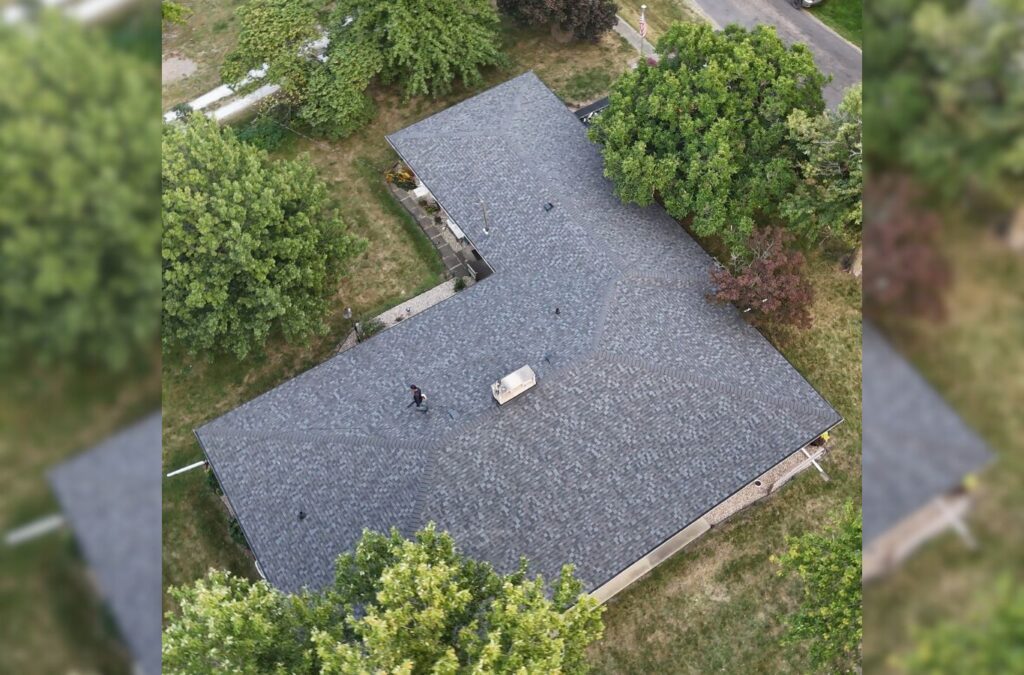 A Surge Exteriors expert finishing residential roofing work in Rushville, IL, demonstrating reliable skill and strong community service. Residential Roofer near me.