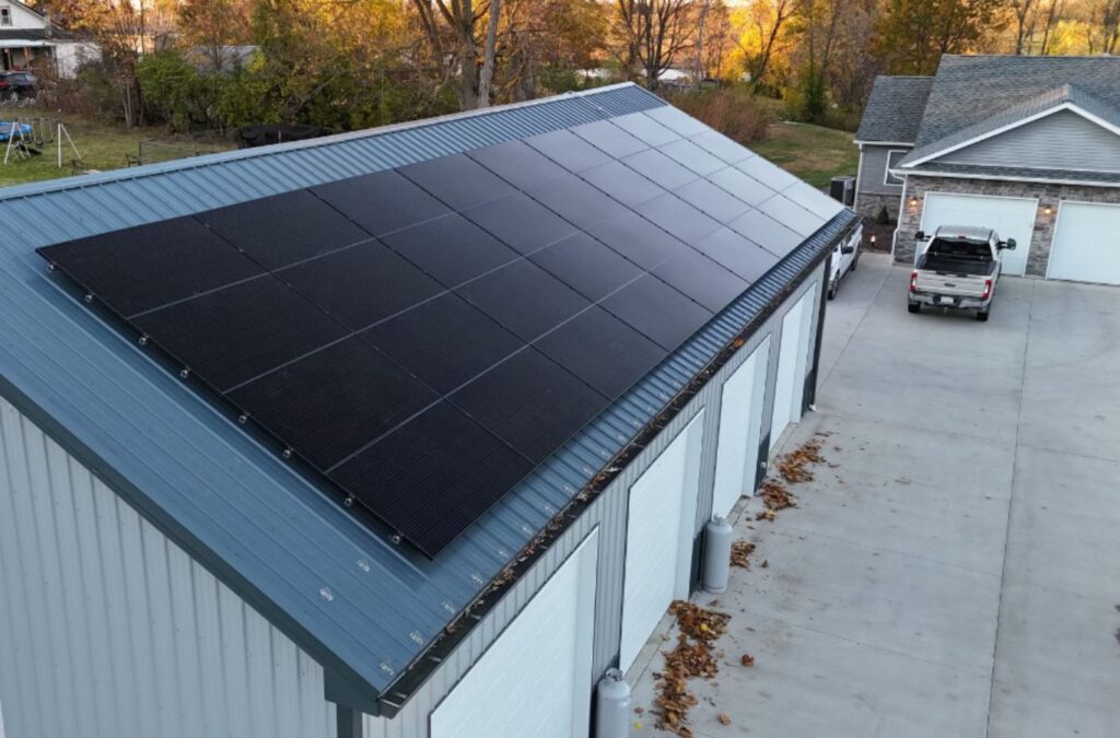 A Surge Exteriors crew member installing metal roofing in Kirksville, MO, showcasing the long-term benefits and professional service quality.