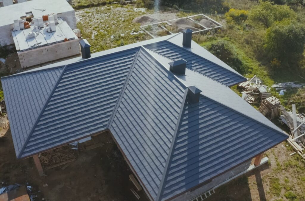 A Surge Exteriors employee delivering expert metal roofing in Kirksville, MO, using high-quality tools and installation methods for reliable results.