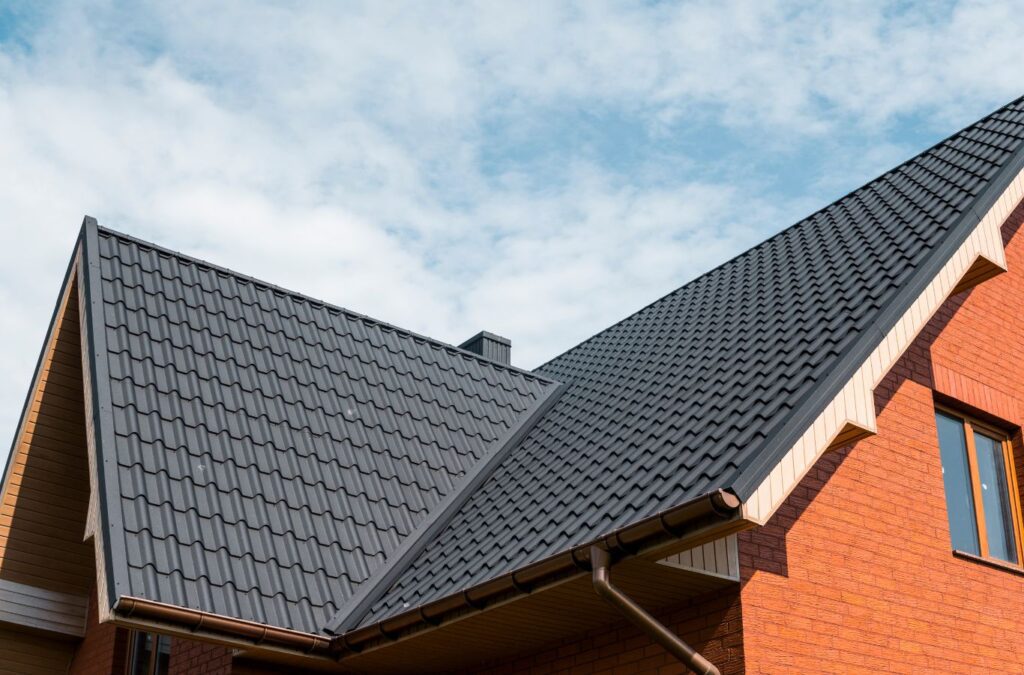 A Surge Exteriors employee providing expert metal roofing services in Palmyra, MO, demonstrating precise tools and professional installation techniques.