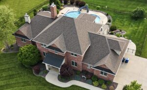 A Surge Exteriors professional working on metal roofing in Quincy, IL, illustrating efficiency and value through local expertise.